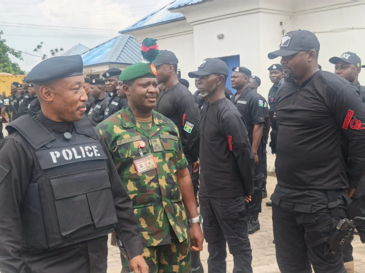 The FCT Commissioner of Police, Ahmed Sanusi, and the Commander of the Guards Brigade, Brig. Gen. A. Onasanya, inspecting personnel of the newly established Violent Crime Response Unit. Credit: Solomon Odeniyi.